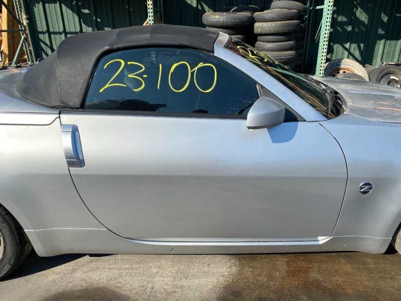 03-04 Nissan 350z Conv. Fuel Filler Door Silver (KY0) OEM 78830CD061