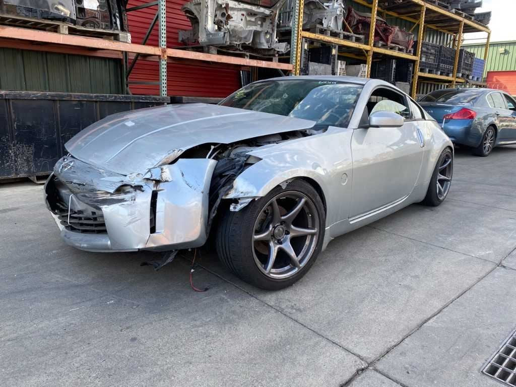 03-05 NISSAN 350Z Console Padded Trim Pair Black/G OEM 68135CD000