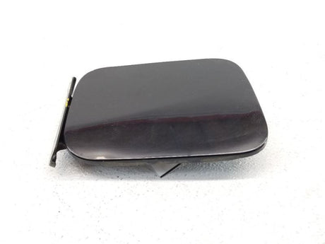 SDN- FUEL FILLER DOOR- BLACK (KH3)